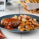 Skillet Meatloaves & Green Beans in Tomato Gravy on a Blue Plate